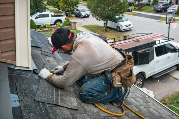 Professional Roofing technician working in Cadogan, PA